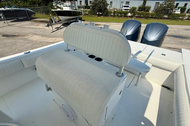 Slide: The Image of 2007 Regulator 29 Forward Seating boat interior with dual engines and cushioned seating. - 8