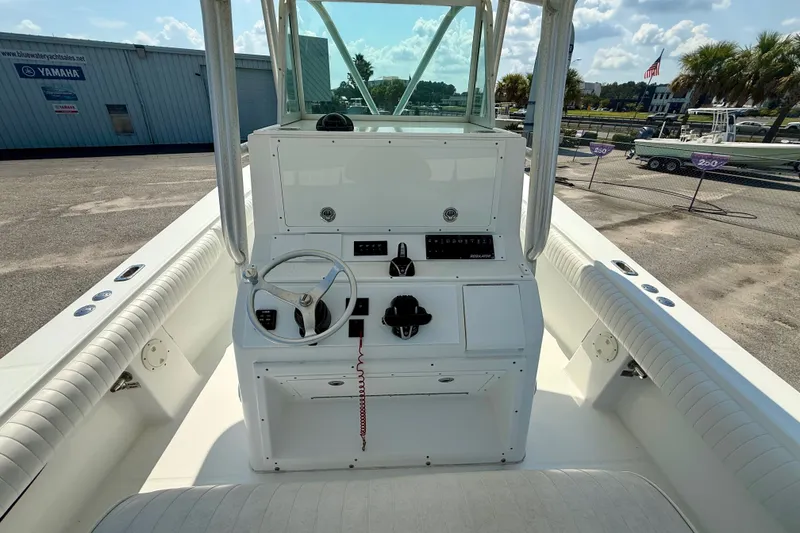 Slide: The Image of 2007 Regulator 29 Forward Seating boat interior with steering console and seating. - 12