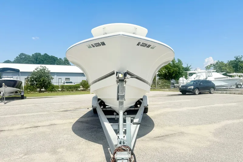 Slide: The Image of 2007 Regulator 29 Forward Seating boat on trailer in sunny outdoor setting. - 7