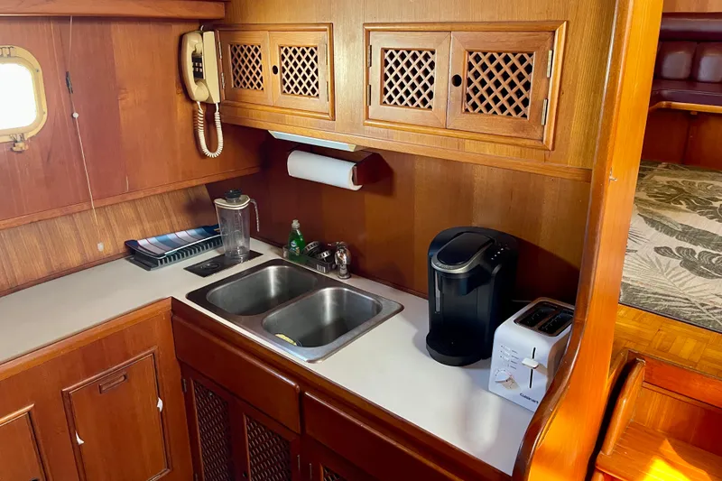 Slide: The Image of Galley kitchen in 1985 CHB 42 boat with sink, coffee maker, and toaster. - 39