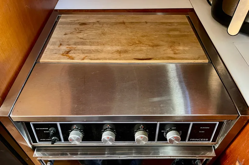 Slide: The Image of Stainless steel stove with wooden cutting board, CHB 42 model, 1985. - 41