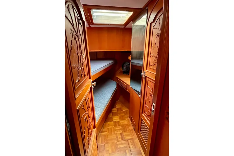 Slide: The Image of Interior of 1985 CHB 42 boat with wooden cabinetry and bunk beds. - 51