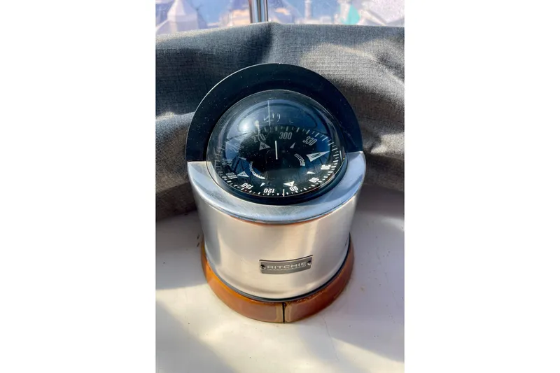 Slide: The Image of Ritchie compass on CHB 42 boat, 1985 model, with sunlight reflection. - 23