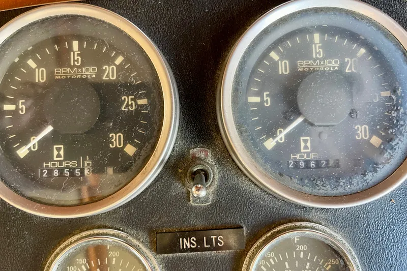 Slide: The Image of Close-up of CHB 42 boat's 1985 dashboard gauges showing RPM and engine hours. - 30