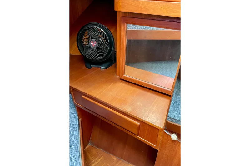 Slide: The Image of Wooden interior of 1985 CHB 42 boat with fan and mirror. - 49
