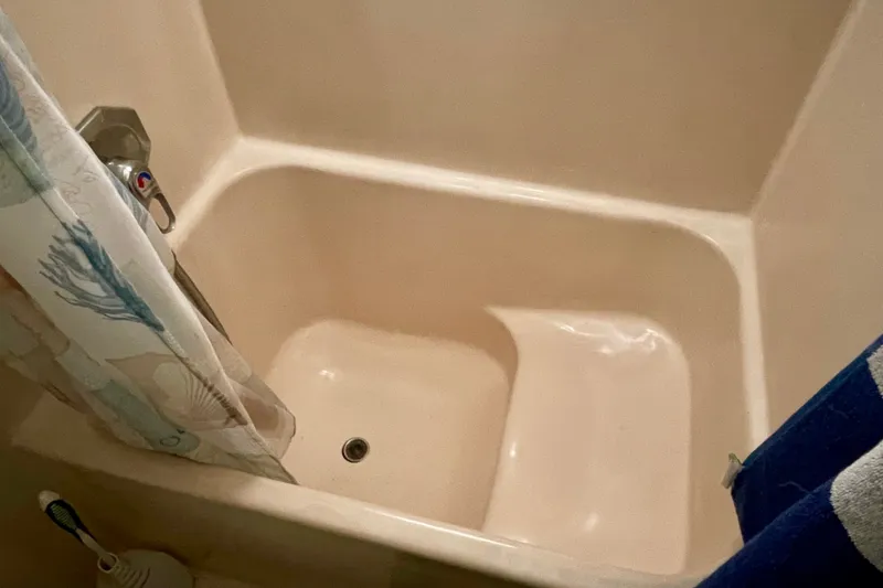 Slide: The Image of Bathtub with shower curtain and faucet in a CHB 42, 1985 model. - 54