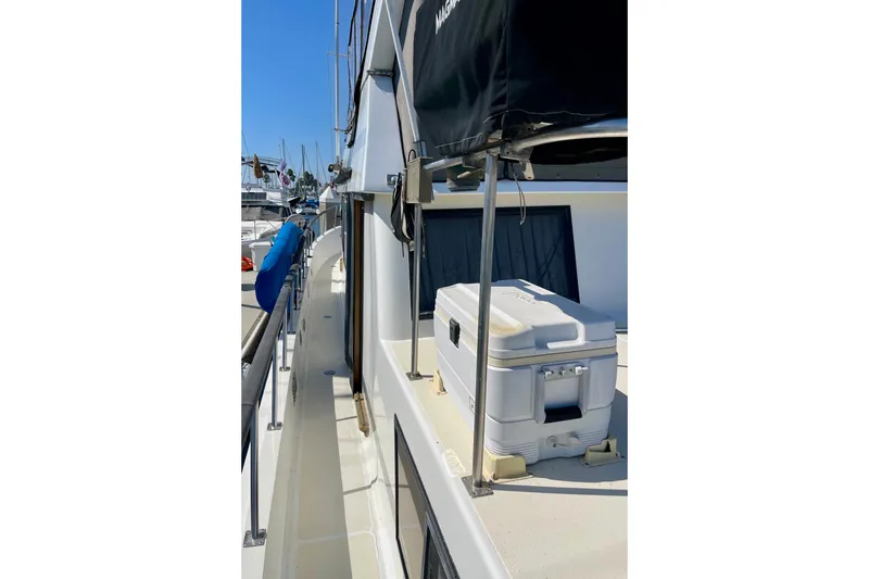 Slide: The Image of Side deck of a 1985 CHB 42 boat with cooler and railing. - 12