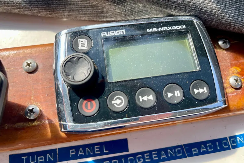 Slide: The Image of Fusion MS-NRX200i marine stereo controller on CHB 42, 1985 model boat dashboard. - 22