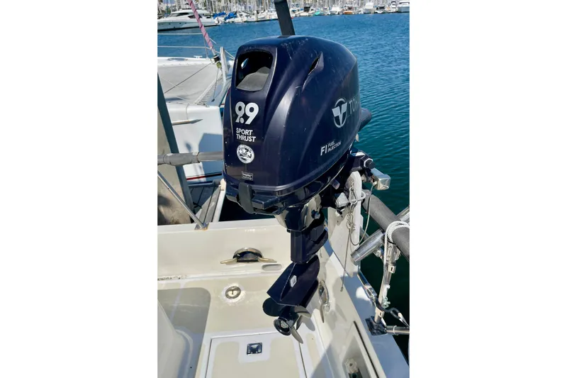 Slide: The Image of Outboard motor on a CHB 42 boat, 1985 model, docked at a marina. - 8