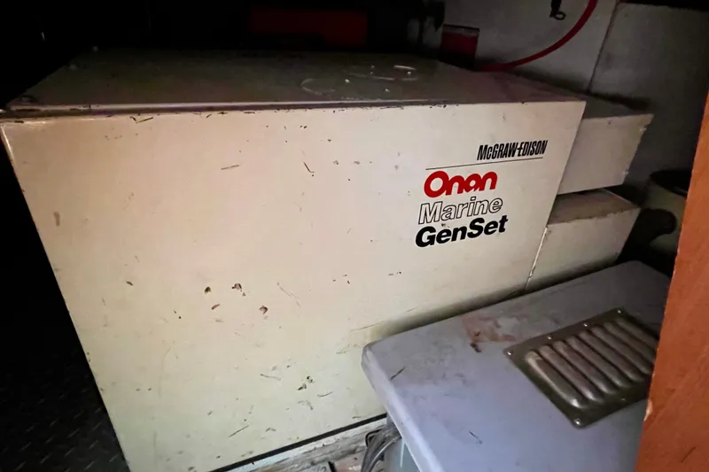 Slide: The Image of Onan Marine GenSet generator inside a 1985 CHB 42 boat engine room. - 62