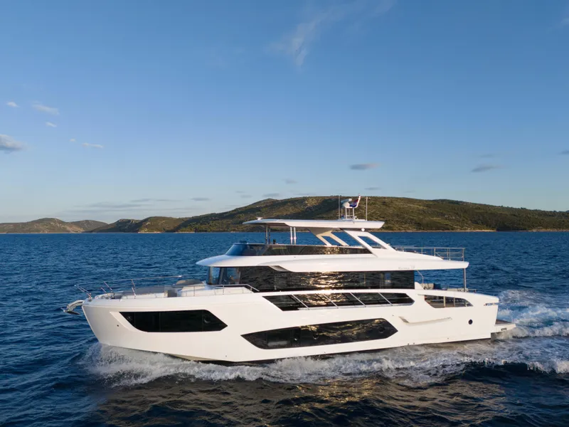 Slide: The Image of Luxurious 2026 Absolute Navetta Co Ownership yacht cruising on open sea. - 0