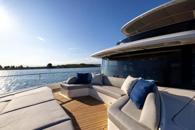 Slide: The Image of Luxurious 2026 Absolute Navetta Co Ownership yacht deck with plush seating and ocean view. - 25