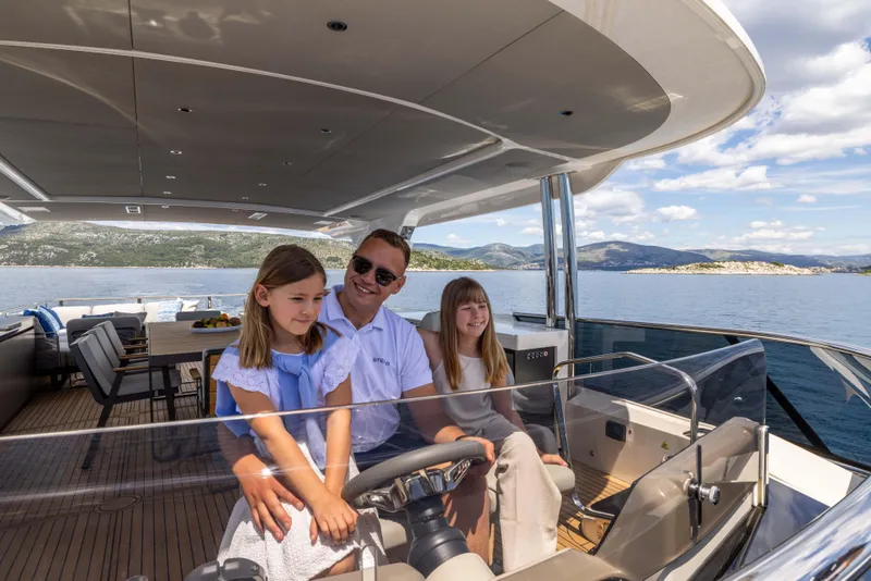 Slide: The Image of Family enjoying a cruise on the 2026 Absolute Navetta Co Ownership yacht. - 9