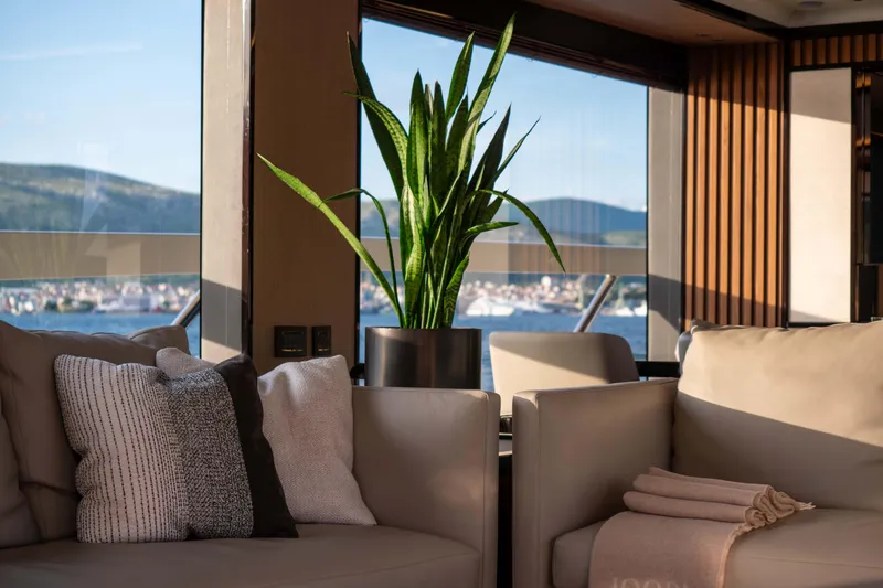 Slide: The Image of Luxurious interior of 2026 Absolute Navetta Co Ownership yacht with elegant seating and scenic views. - 42