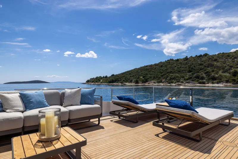 Slide: The Image of Luxurious deck of 2026 Absolute Navetta Co Ownership yacht with scenic ocean view. - 37
