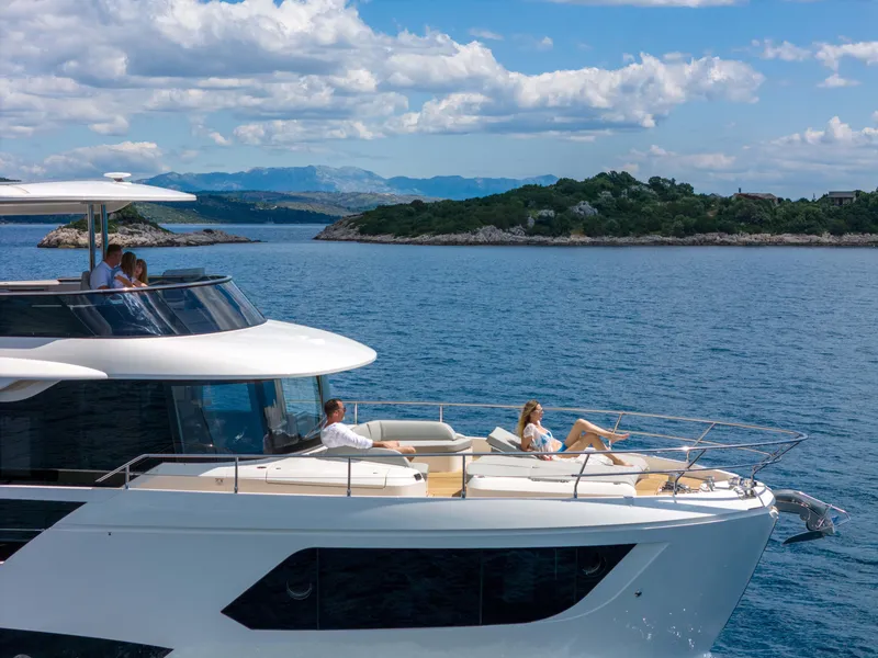 Slide: The Image of Luxury yacht Absolute Navetta Co Ownership 2026 cruising near scenic coastline. - 12