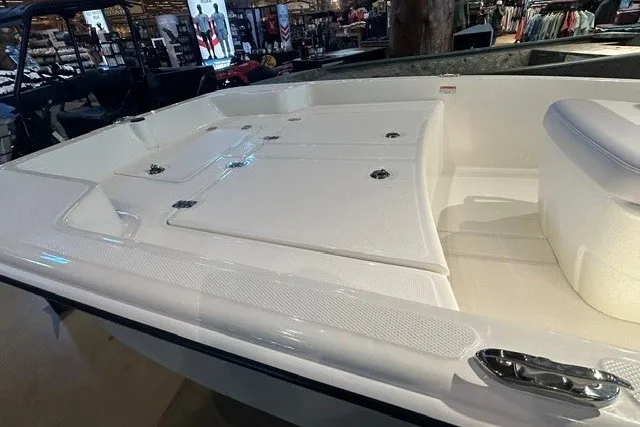 Slide: The Image of 2027 Mako Pro Skiff 15 CC boat interior, showcasing spacious deck and seating. - 6