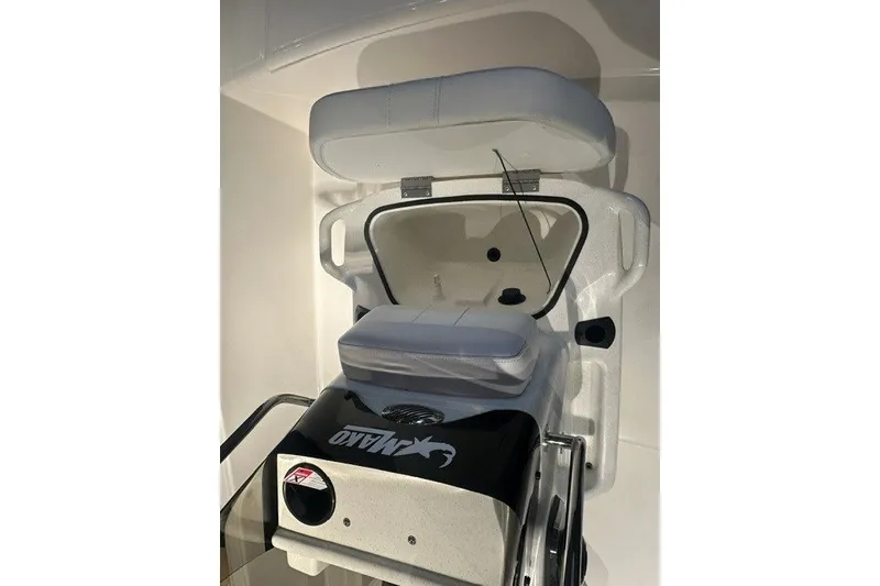 Slide: The Image of 2027 Mako Pro Skiff 15 CC boat seat with storage compartment open. - 8