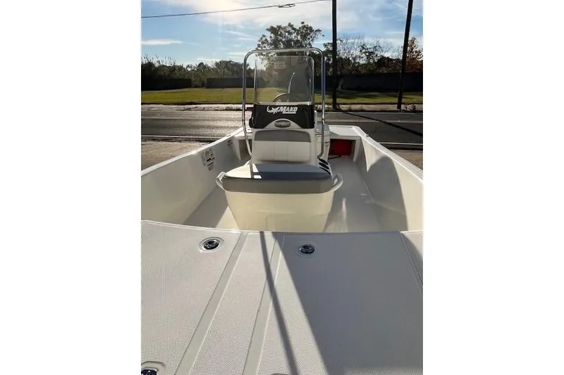 The Image of 2027 Mako Pro Skiff 15 CC boat with center console, viewed from the bow. - 0