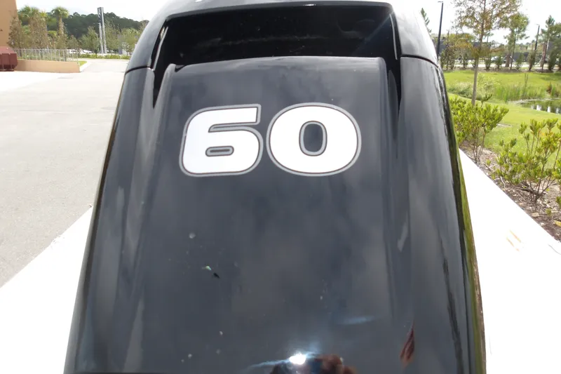 Slide: The Image of Outboard motor with "60" marking on a 2027 Mako Pro Skiff 15 CC boat. - 4