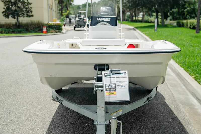 Slide: The Image of 2027 Mako Pro Skiff 15 CC boat on trailer, displayed outdoors. - 3