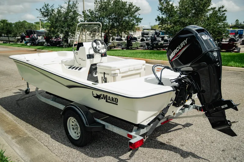 Slide: The Image of 2027 Mako Pro Skiff 15 CC boat with Mercury 60 engine on trailer. - 6