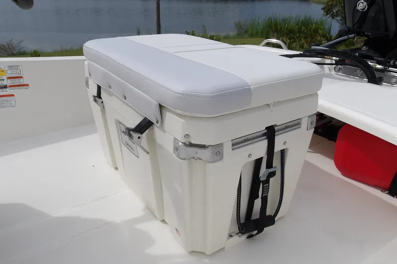 Slide: The Image of 2027 Mako Pro Skiff 15 CC boat with cushioned storage seat. - 12