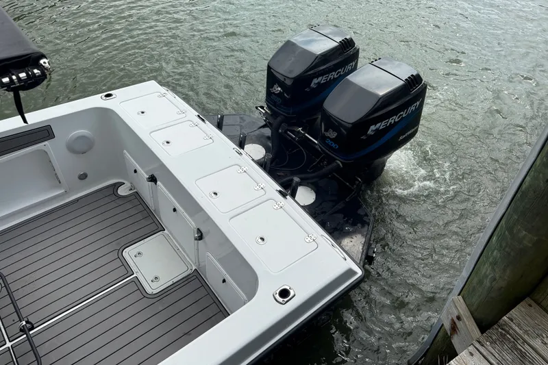 Slide: The Image of 1999 Blue Fin 260 Profish boat with dual Mercury outboard engines on water. - 8