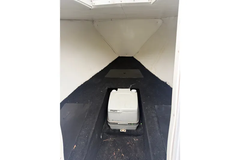 Slide: The Image of Interior cabin of 1999 Blue Fin 260 Profish boat with portable toilet. - 27