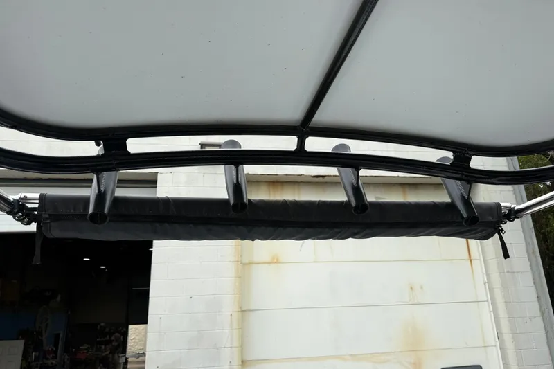 Slide: The Image of T-top rod holders on a 1999 Blue Fin 260 Profish boat, viewed from below. - 25