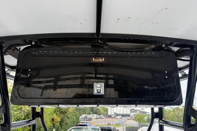 Slide: The Image of Overhead storage compartment on a 1999 Blue Fin 260 Profish boat. - 17