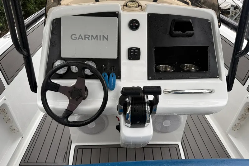 Slide: The Image of Center console of a 1999 Blue Fin 260 Profish boat with Garmin navigation system. - 16