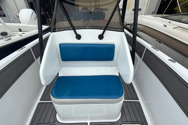 Slide: The Image of Blue Fin 260 Profish 1999 boat interior with blue cushioned seating. - 13
