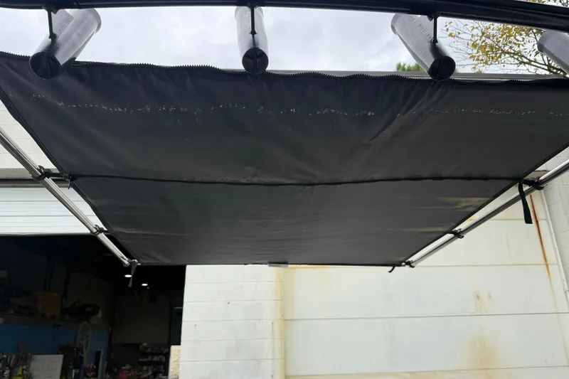 Slide: The Image of Black canopy on a 1999 Blue Fin 260 Profish boat, viewed from below. - 26