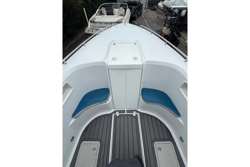 Slide: The Image of 1999 Blue Fin 260 Profish boat interior with seating and storage compartments. - 10