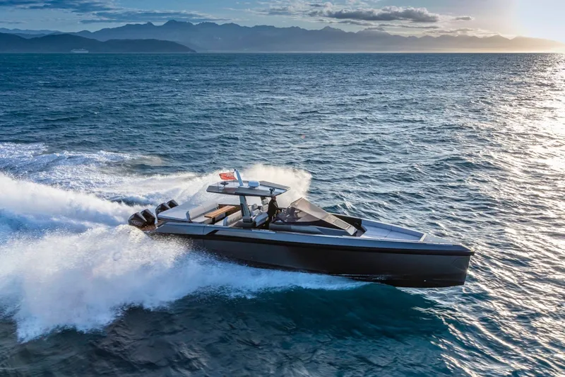 Slide: The Image of Wally wallytender48X 2026 cruising on open sea at sunset. - 2