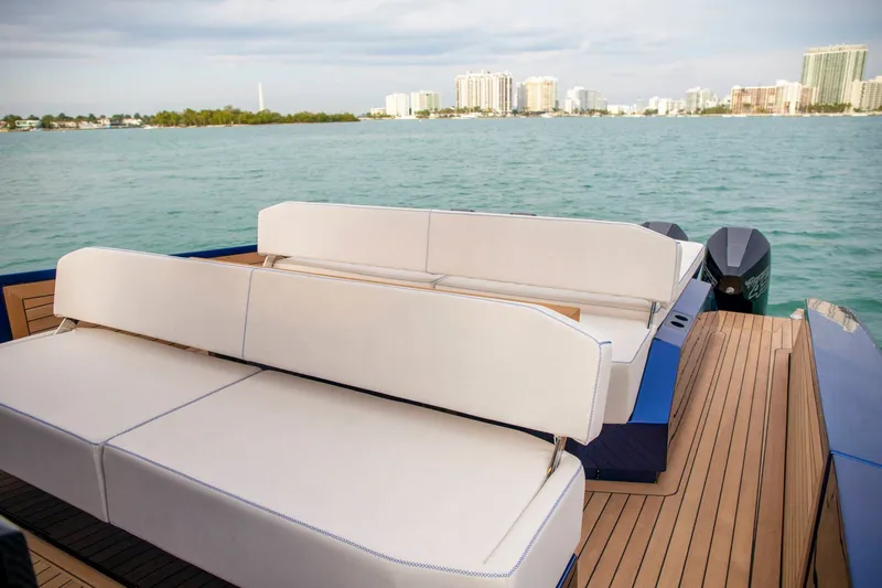 Slide: The Image of Luxury seating on 2026 Wally wallytender48X yacht, with scenic waterfront view. - 14
