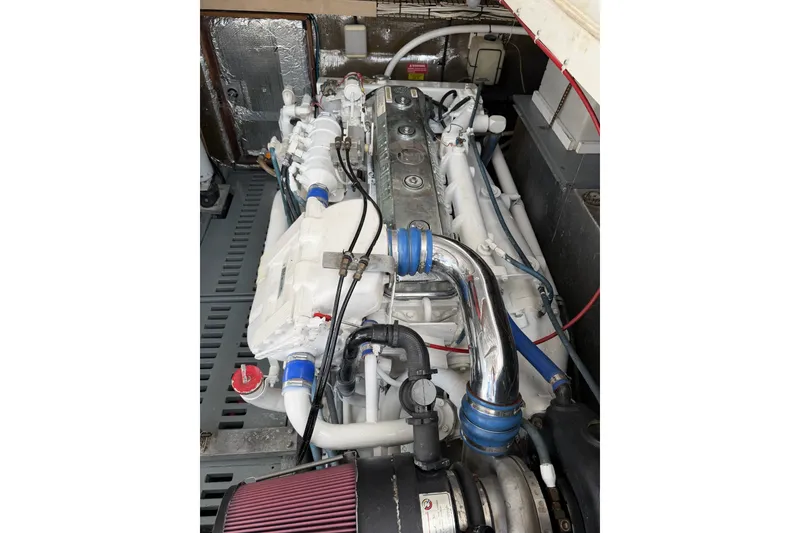Slide: The Image of Engine compartment of a 1998 Luhrs 40 Open boat, showcasing detailed mechanical components. - 30