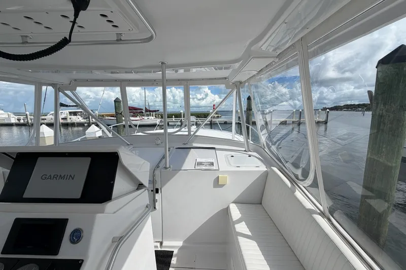 Slide: The Image of 1998 Luhrs 40 Open boat interior with Garmin navigation, docked at marina. - 24