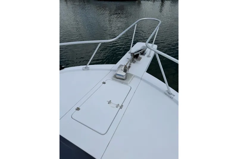 Slide: The Image of Bow of 1998 Luhrs 40 Open boat with anchor and railing. - 35