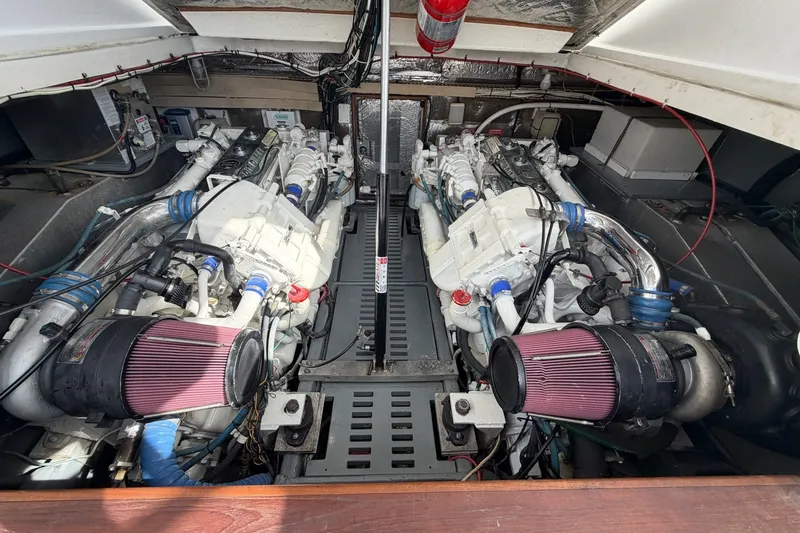 Slide: The Image of Engine room of a 1998 Luhrs 40 Open boat, showcasing dual engines and components. - 28