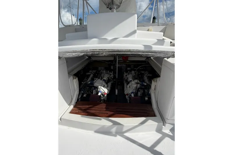 Slide: The Image of Engine compartment of 1998 Luhrs 40 Open yacht, showcasing dual engines. - 27