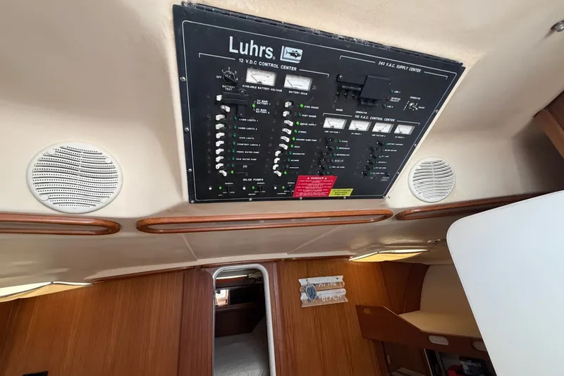 Slide: The Image of 1998 Luhrs 40 Open yacht interior with control panel and speakers. - 20