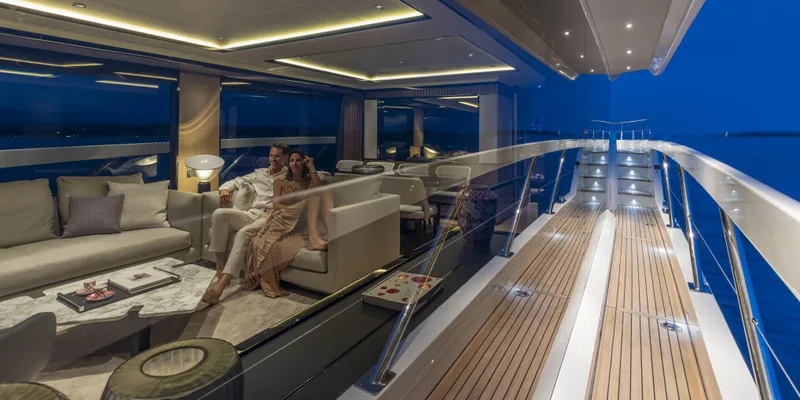 Slide: The Image of Luxurious 2025 Absolute NAVETTA 75 yacht interior with elegant seating and ambient lighting. - 15