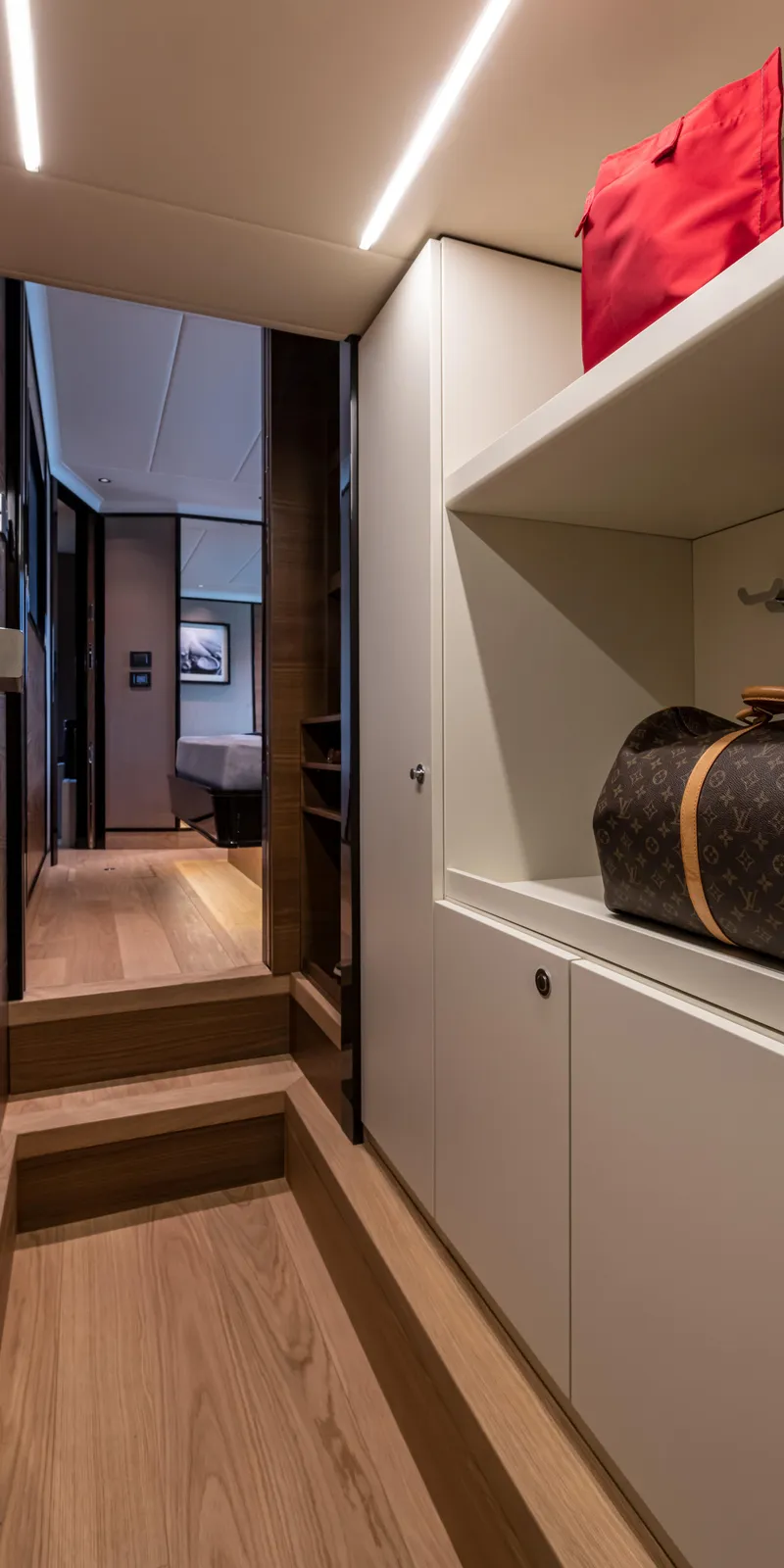 Slide: The Image of Luxurious interior of 2025 Absolute NAVETTA 75 yacht with modern design and elegant wood flooring. - 25