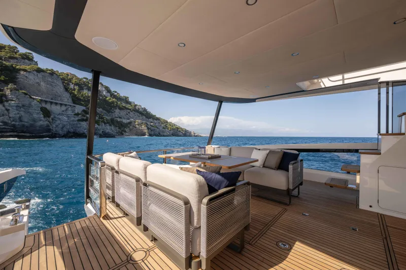 Slide: The Image of Luxurious deck of 2026 Absolute Navetta 58 yacht with ocean view and elegant seating. - 10