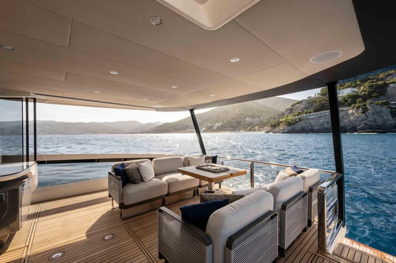 Slide: The Image of Luxurious 2026 Absolute Navetta 58 yacht deck with ocean view and elegant seating. - 8