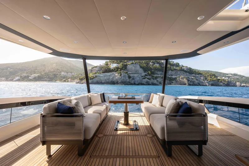 Slide: The Image of Luxurious Absolute Navetta 58 yacht deck with elegant seating, scenic ocean view, 2026 model. - 7