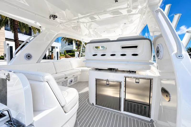 Slide: The Image of Luxurious interior of 2022 Intrepid 477 Evolution yacht with sleek seating and modern amenities. - 14