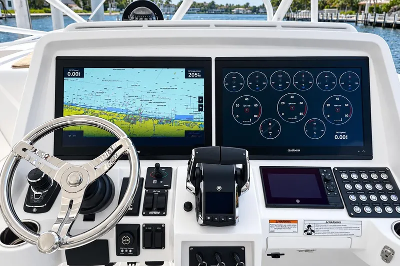 Slide: The Image of Intrepid 477 Evolution 2022 helm with dual Garmin displays and modern controls. - 20
